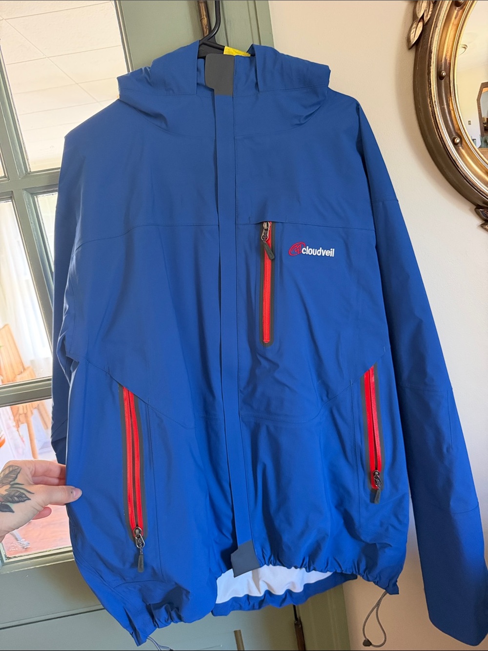 Cloudveil Men's Blue Raincoat with Red Zip Accents